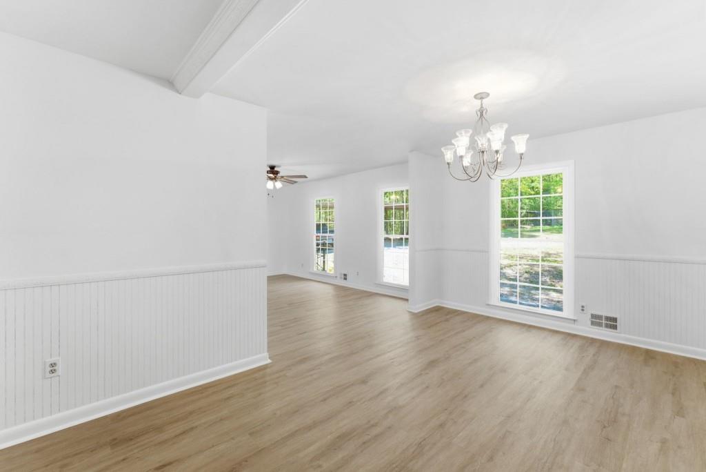 224 Old Franklin Street Roopville, GA 30170 - Photo 15 of 60 an empty room with wooden floor and windows