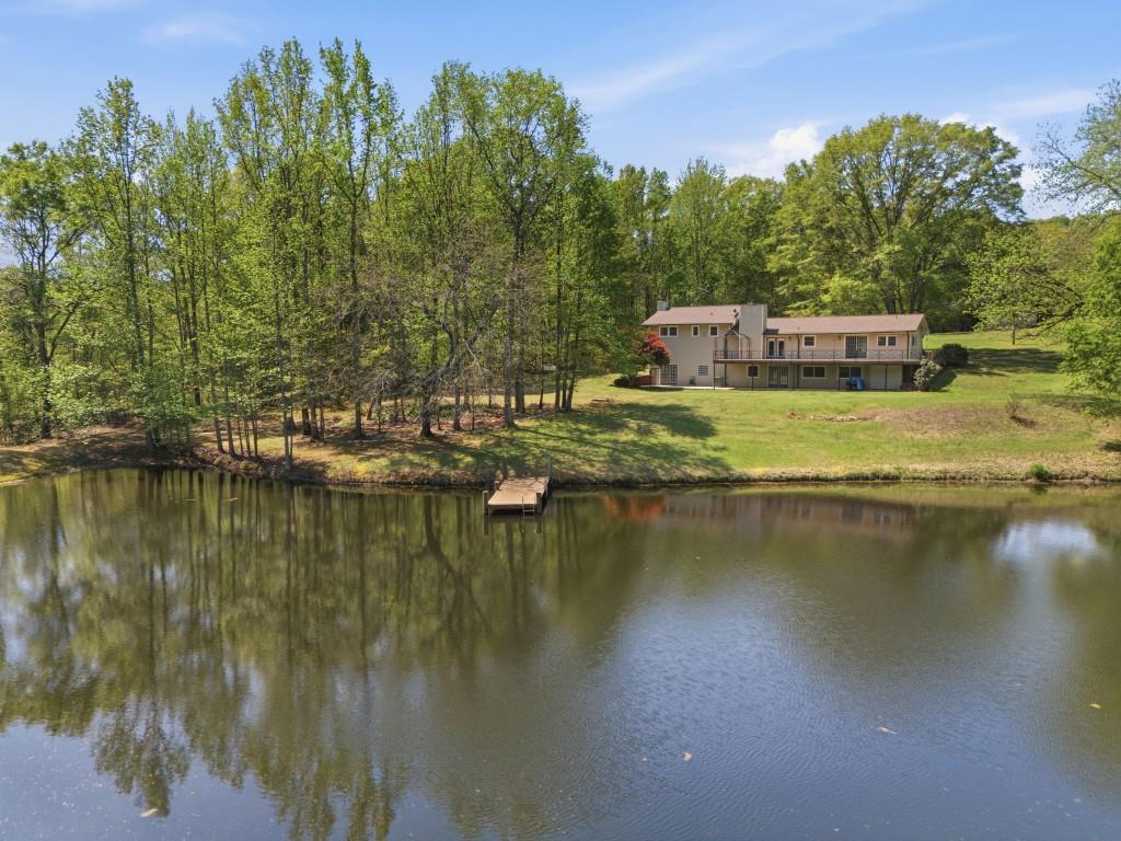 224 Old Franklin Street Roopville, GA 30170 - Photo 16 of 60 a view of a lake with houses in the background