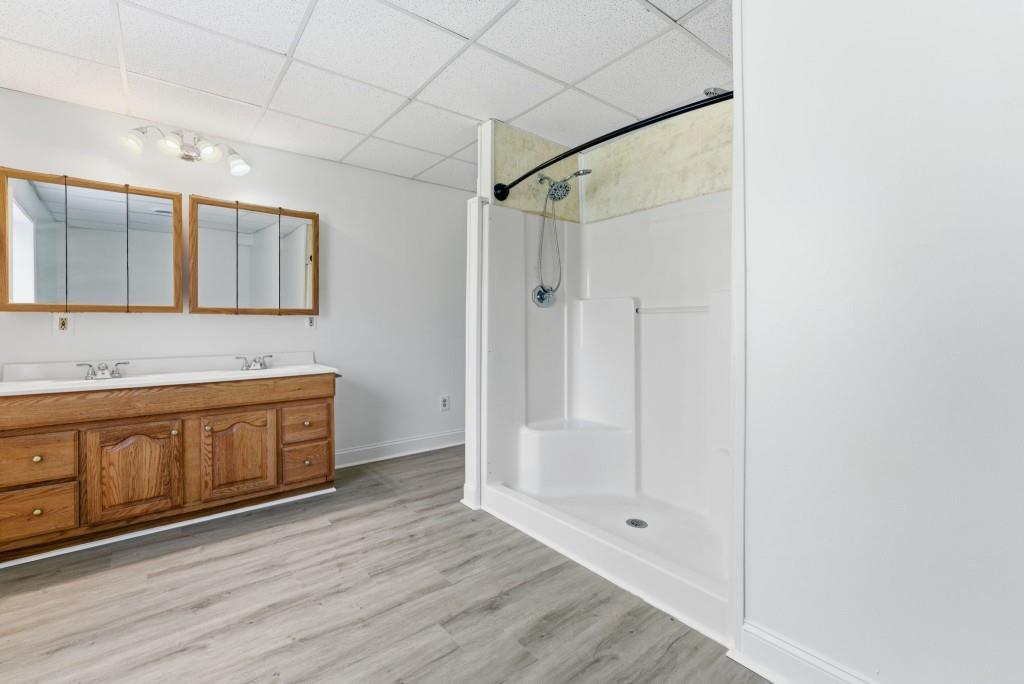 224 Old Franklin Street Roopville, GA 30170 - Photo 21 of 60 a bathroom with a granite countertop sink mirror and shower