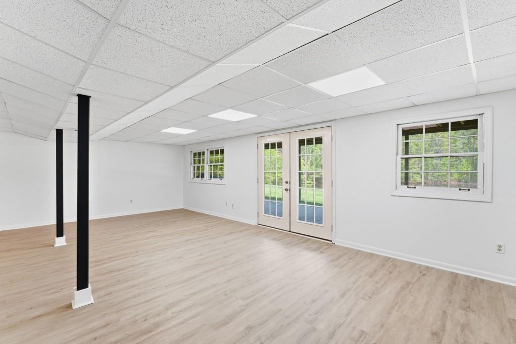 224 Old Franklin Street Roopville, GA 30170 - Photo 22 of 60 an empty room with wooden floor and windows