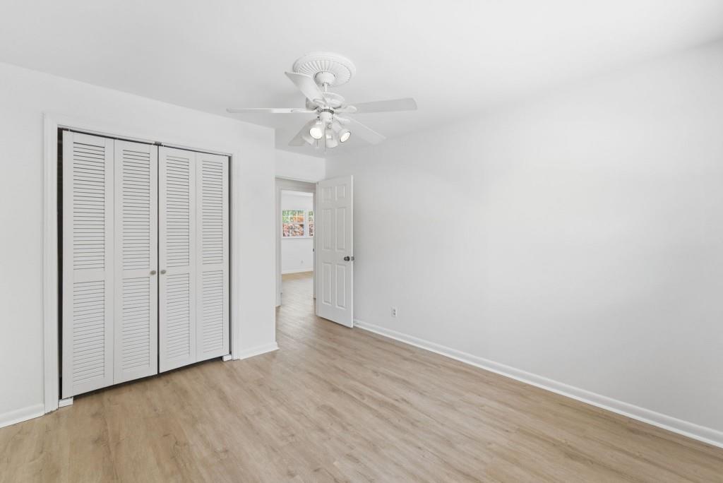 224 Old Franklin Street Roopville, GA 30170 - Photo 35 of 60 an empty room with wooden floor closet and windows