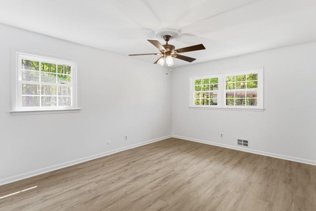 224 Old Franklin Street Roopville, GA 30170 - Photo 36 of 60 a view of empty room with wooden floor and fan