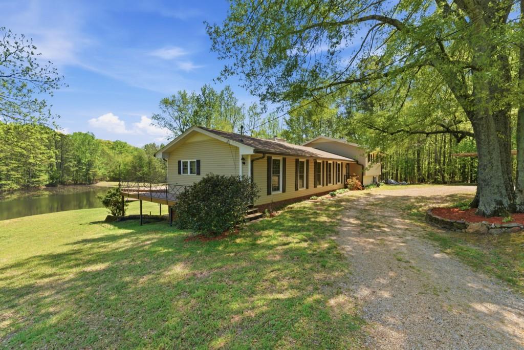 224 Old Franklin Street Roopville, GA 30170 - Photo 4 of 60 a house with swimming pool in front of it