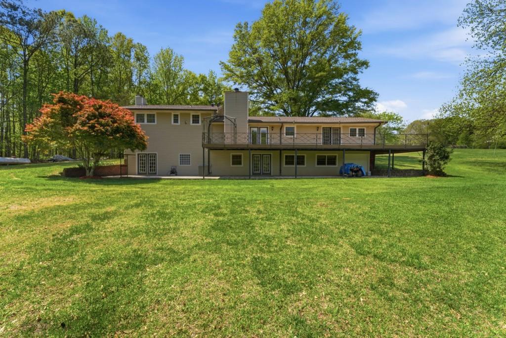224 Old Franklin Street Roopville, GA 30170 - Photo 45 of 60 a view of a house with a yard and sitting area