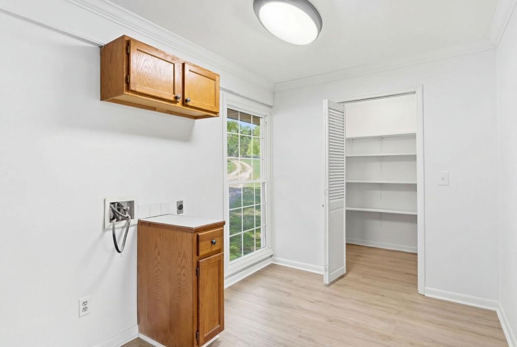 224 Old Franklin Street Roopville, GA 30170 - Photo 55 of 60 a room with a wooden floor and cabinets