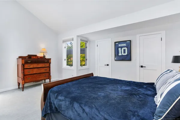 a bedroom with a bed and a cabinets