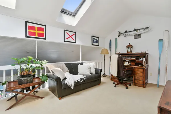 a bed room with furniture and a chair