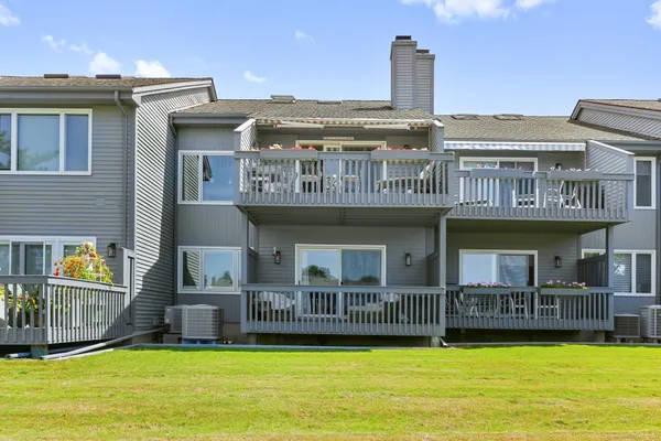 a view of a house with swimming pool and deck