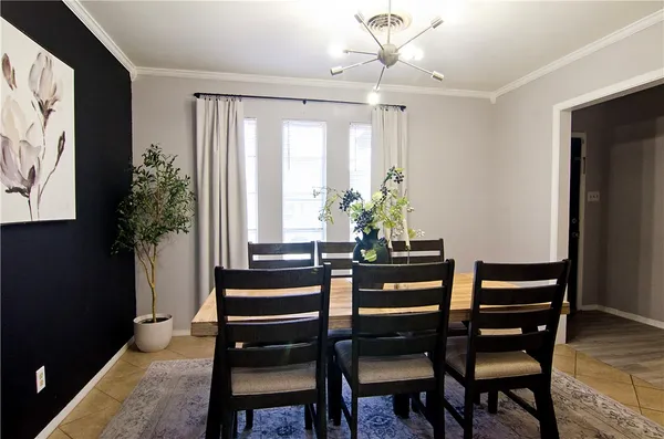 a view of a dining room with furniture and window