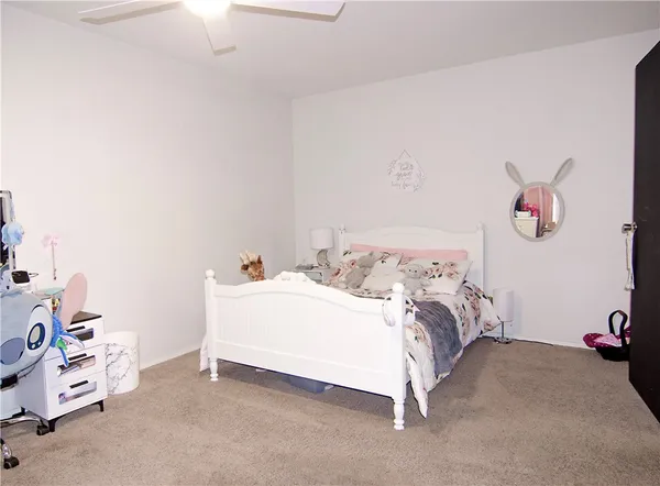 a bed room with furniture and a flat screen tv