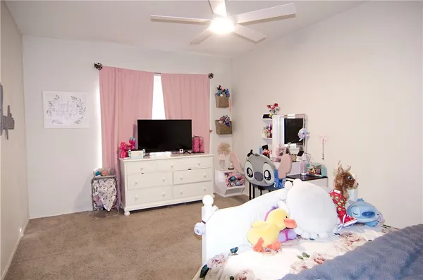 a view of workspace with windows and ceiling fan