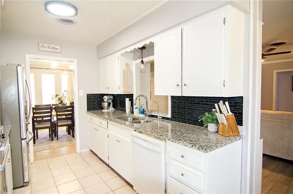a kitchen with a sink and cabinets