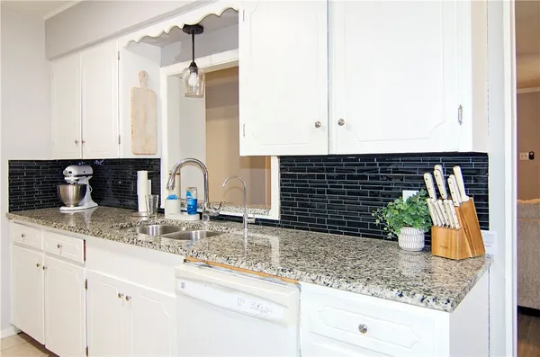 a kitchen with sink and window