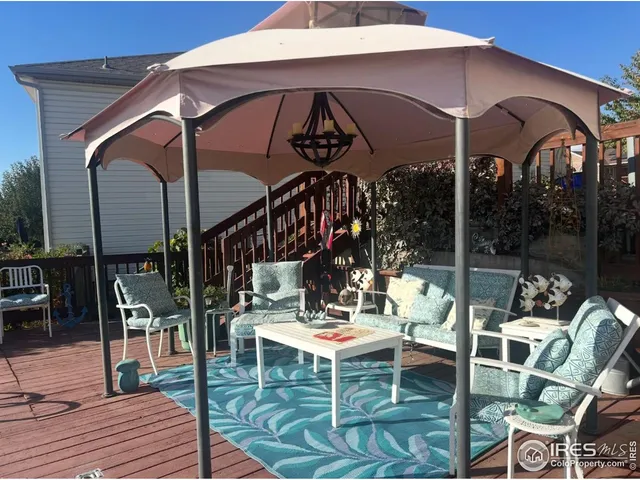 a view of a chairs and table in patio
