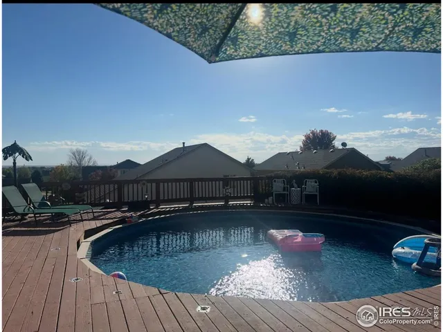 a view of swimming pool with seating space