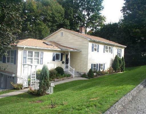 31 Abbott Avenue Ridgefield, CT 06877 - Photo 1 of 1 a view of a house with a yard and plants