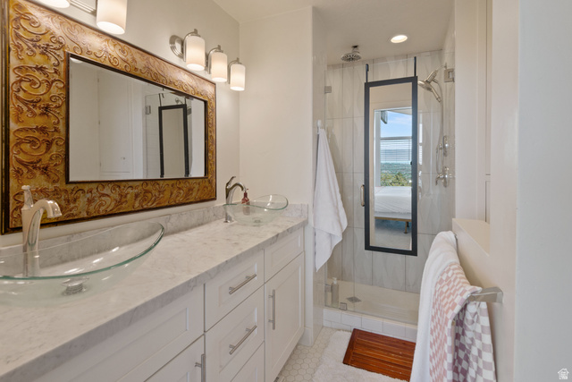 1900 North 100 East Provo, UT 84604 - Photo 18 of 49 Dual glass vessel sinks set on a light countertop with a decorative framed mirror