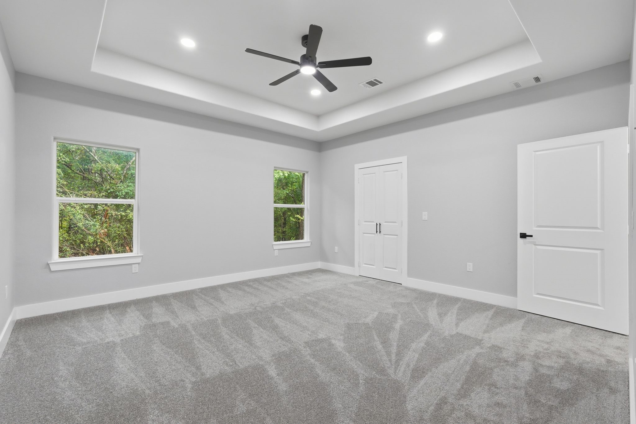 3575 Roy Bean Road Willis, TX 77378 - Photo 19 of 40 an empty room with ceiling fan and windows