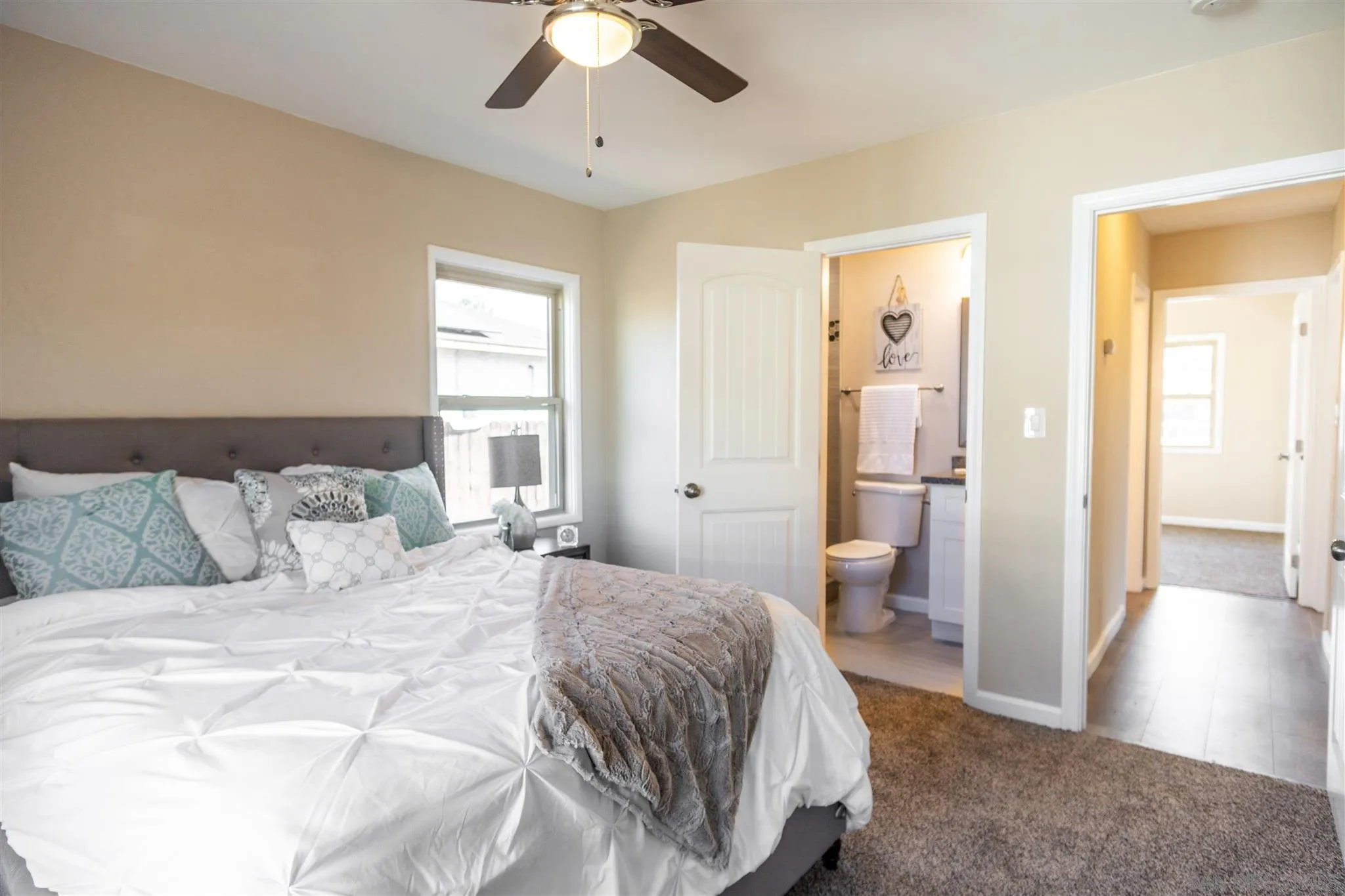 7204 Waite Drive La Mesa, CA 91941 - Photo 12 of 18 a bedroom with a large bed and a chandelier