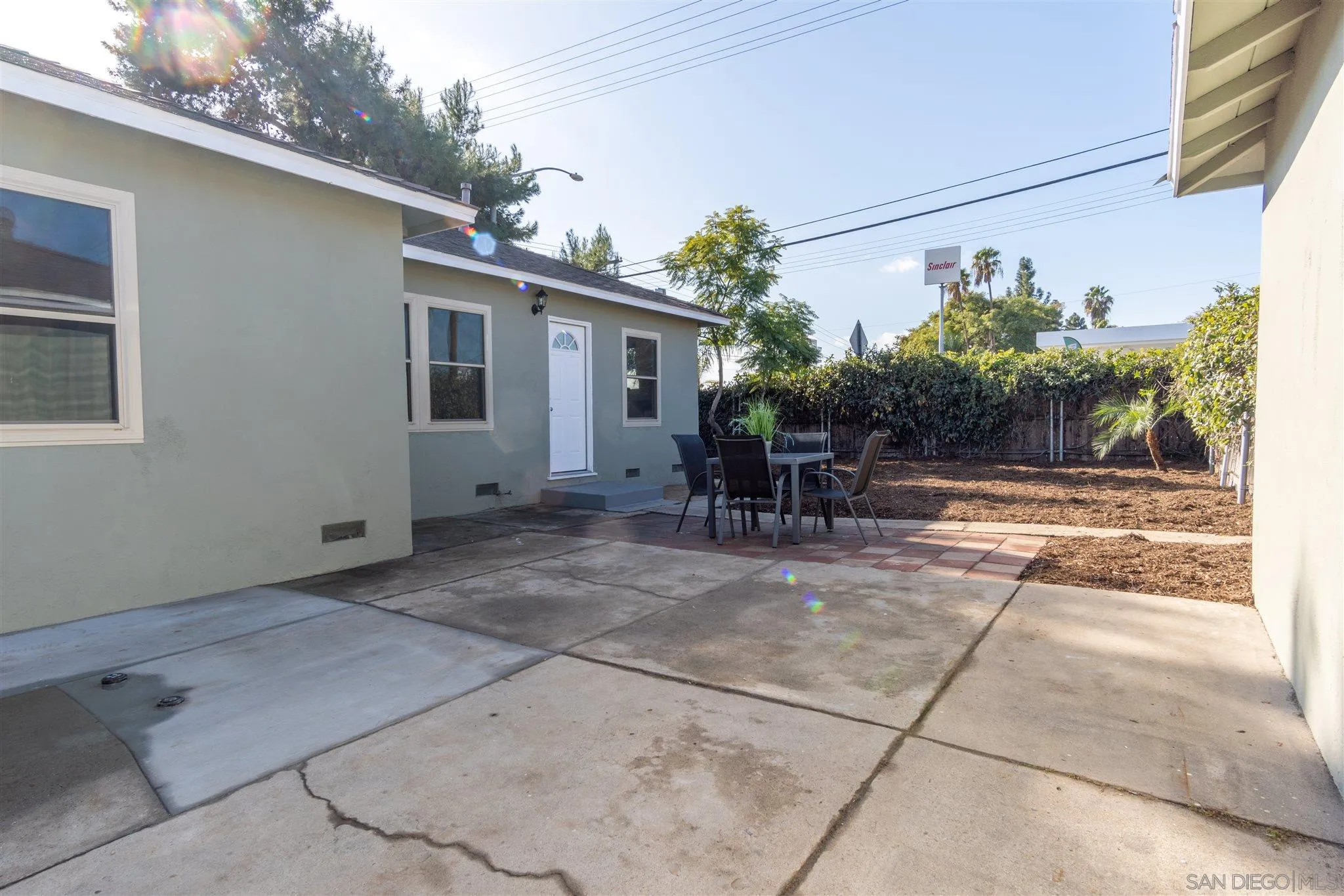 7204 Waite Drive La Mesa, CA 91941 - Photo 17 of 18 a view of a patio with table and chairs and potted plants