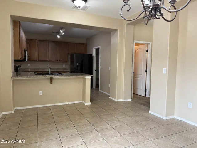 a view of a kitchen with a sink and cabinets