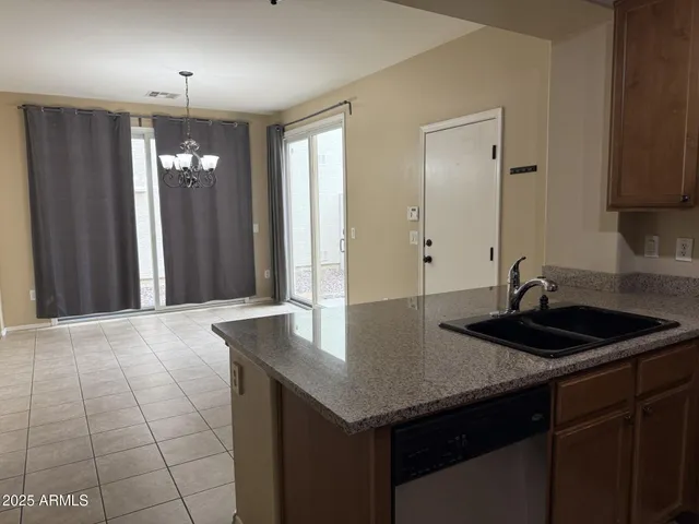 a kitchen with a sink and a refrigerator