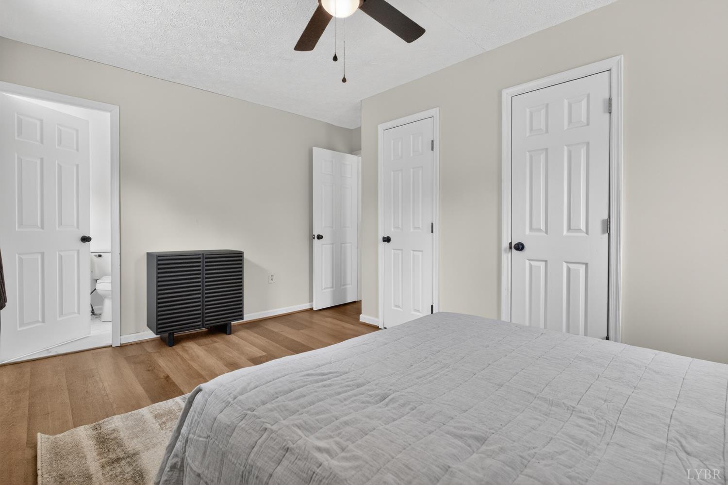 5981-3 3 Creeks Road Gladys, VA 24554 - Photo 26 of 37 a bedroom with a bed and a chandelier