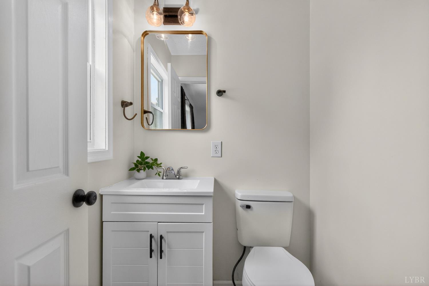 5981-3 3 Creeks Road Gladys, VA 24554 - Photo 27 of 37 a bathroom with a toilet a sink and mirror