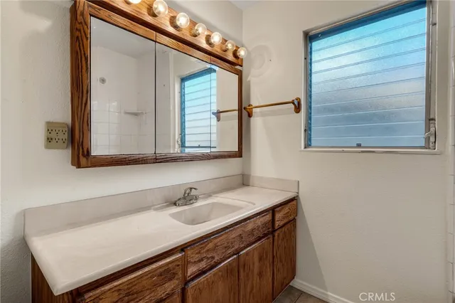 a bathroom with a sink and a mirror