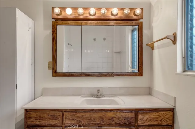 a bathroom with a sink and mirror