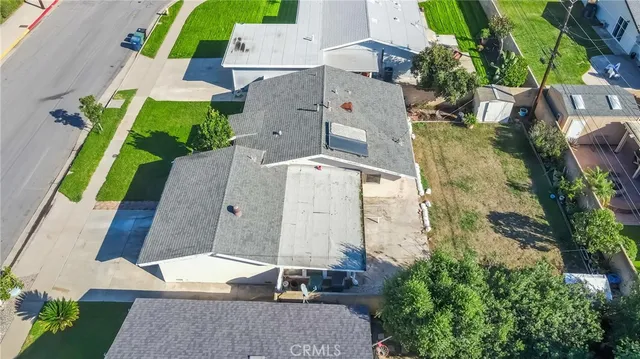 an aerial view of a house with a swimming pool