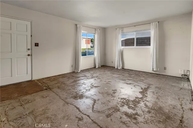 an empty room with windows