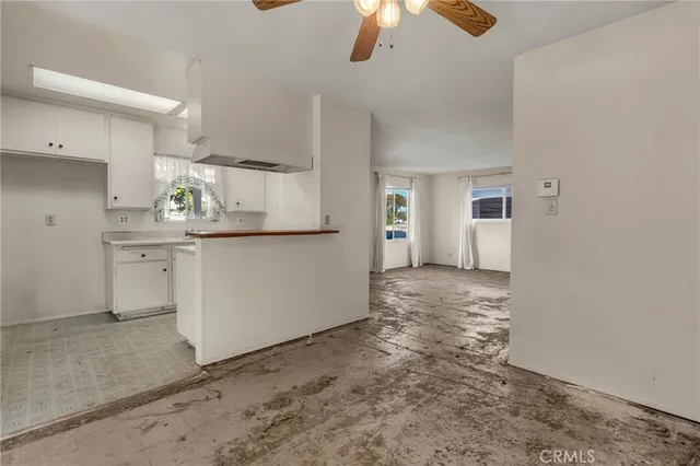 a view of a kitchen with a sink and cabinets