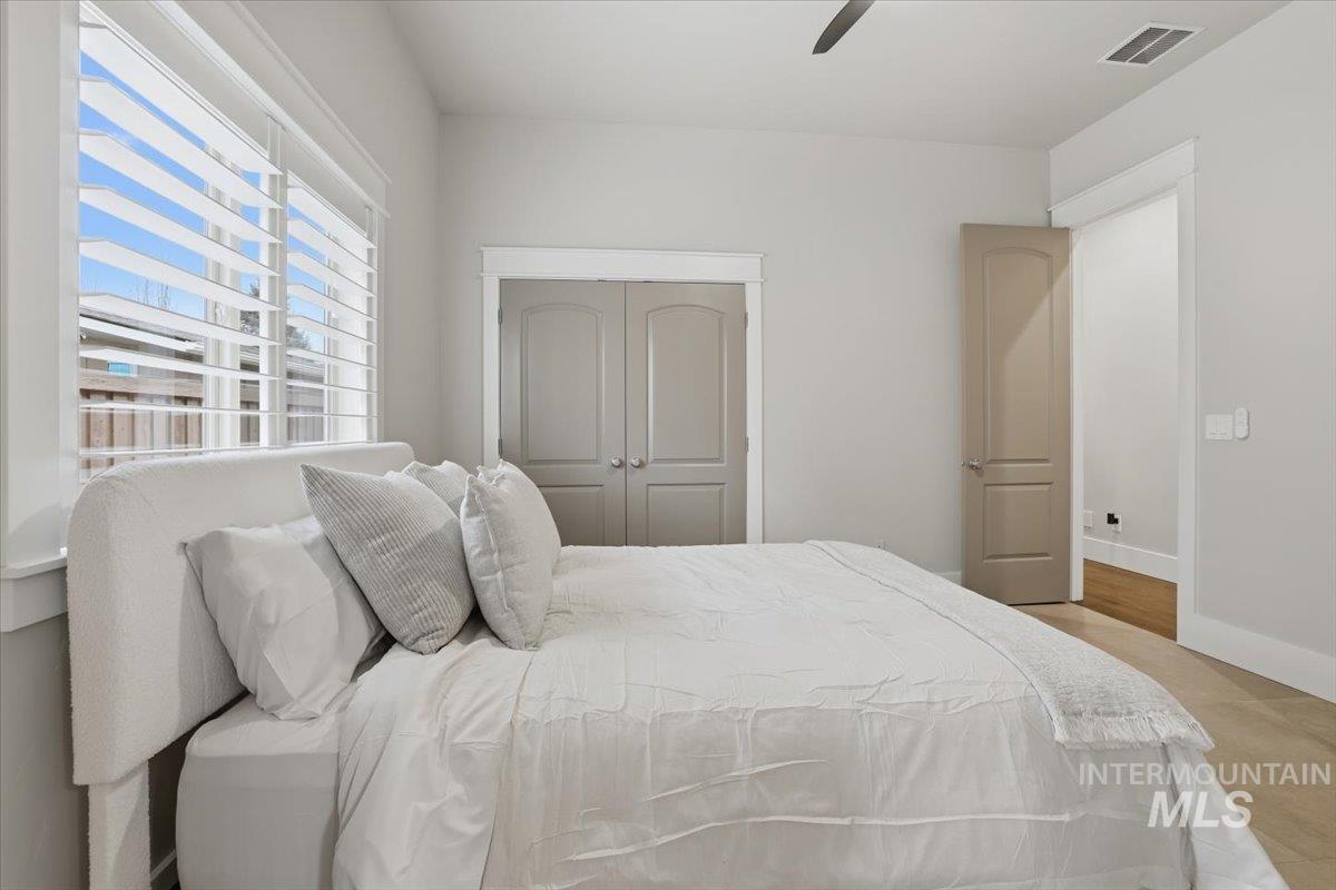 6590 North Fairborn Avenue Meridian, ID 83646 - Photo 38 of 49 Bedroom with a closet and a ceiling fan