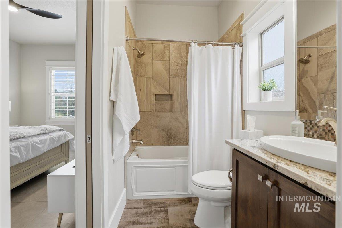 6590 North Fairborn Avenue Meridian, ID 83646 - Photo 39 of 49 Bathroom featuring vanity, shower / tub combo, and ensuite bath