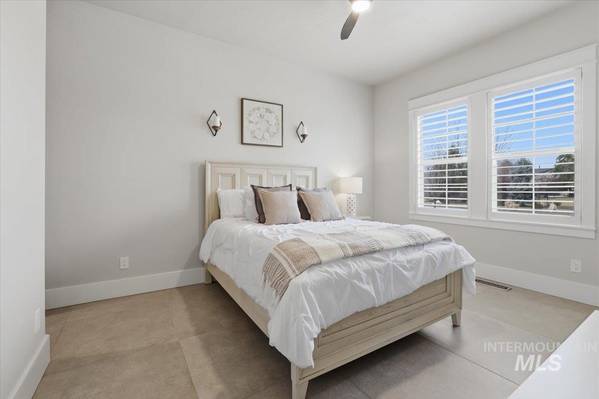 6590 North Fairborn Avenue Meridian, ID 83646 - Photo 40 of 49 Bedroom featuring baseboards and a ceiling fan