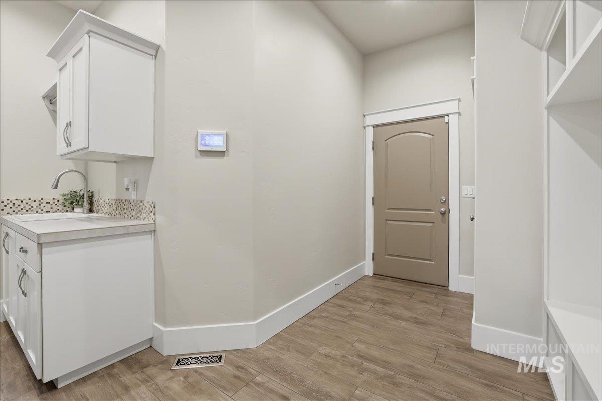 6590 North Fairborn Avenue Meridian, ID 83646 - Photo 43 of 49 Washroom with light wood finished floors and baseboards