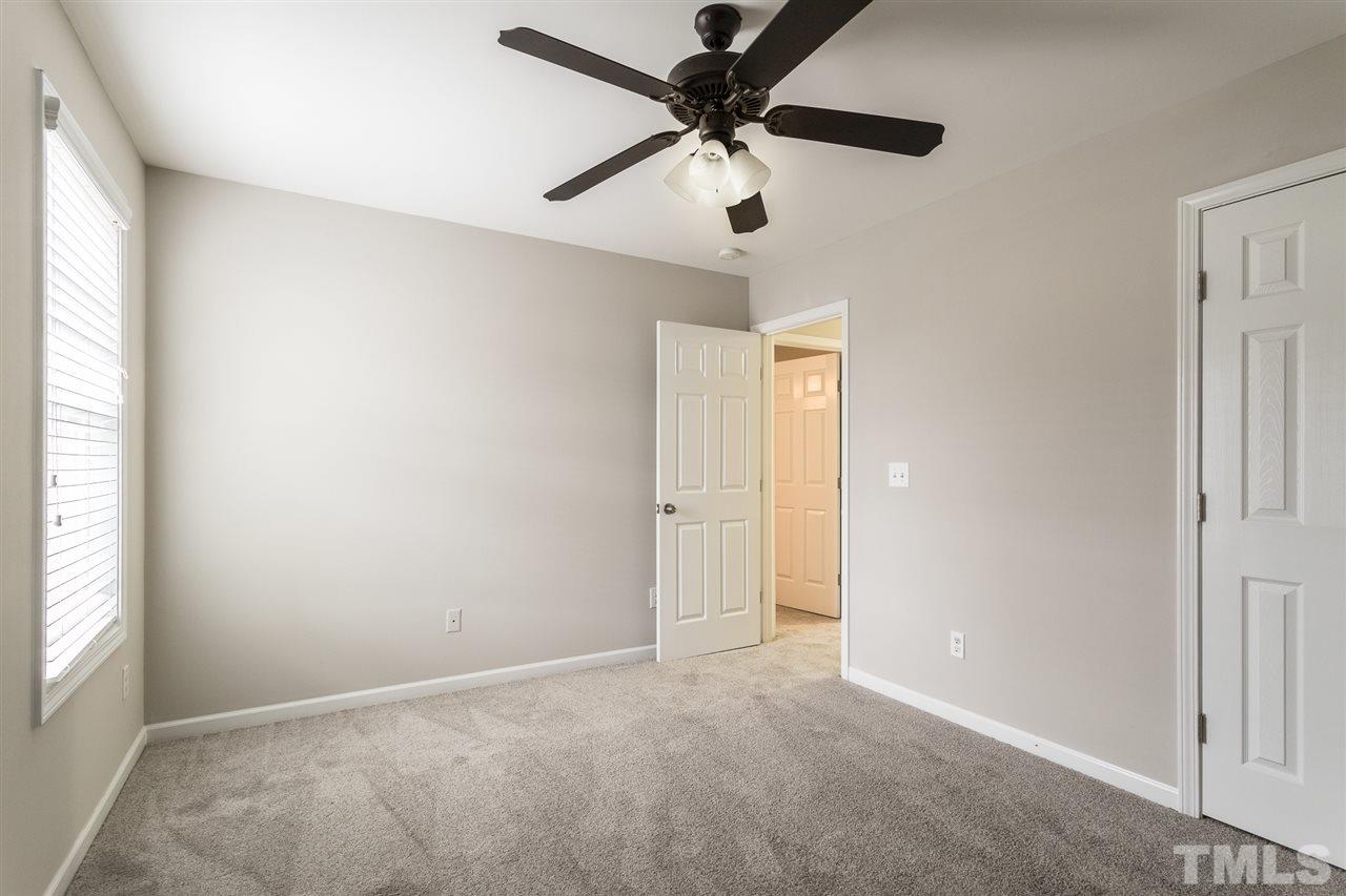 1354 Regulator Street Raleigh, NC 27603 - Photo 22 of 30 an empty room with a window and a fan