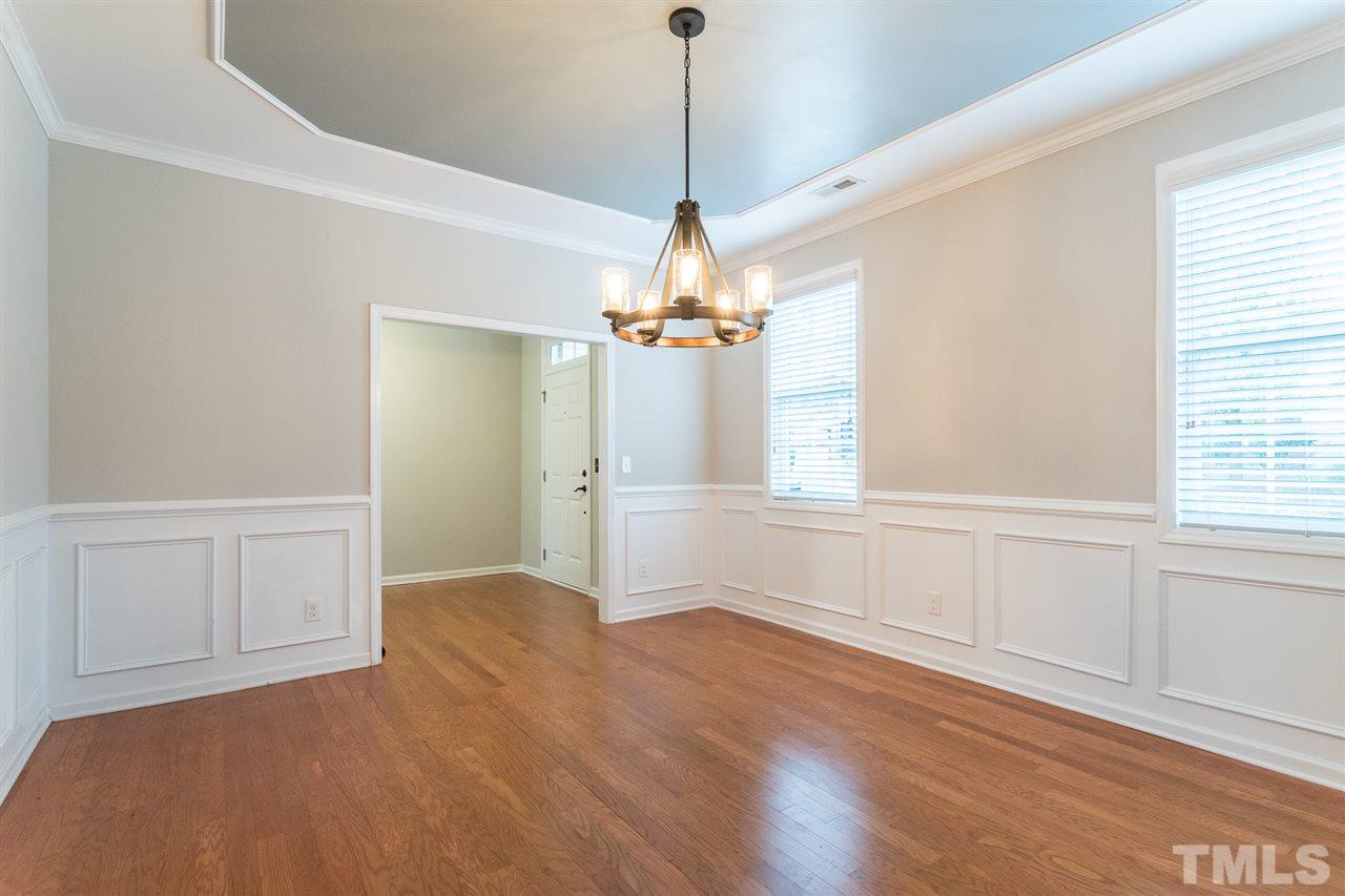 1354 Regulator Street Raleigh, NC 27603 - Photo 8 of 30 a view of empty room with wooden floor and fan