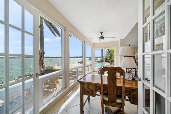 a view of a swimming pool with an outdoor seating