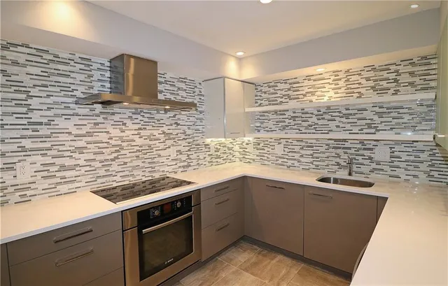 a kitchen with a sink and cabinets