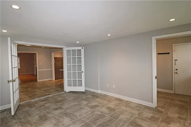 a kitchen with a refrigerator and cabinets