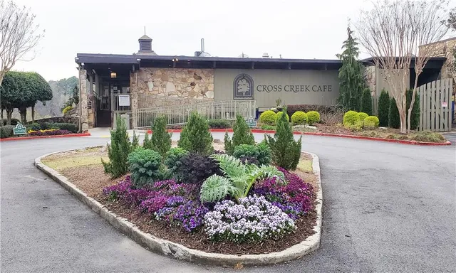 a view of a golf course with a lake