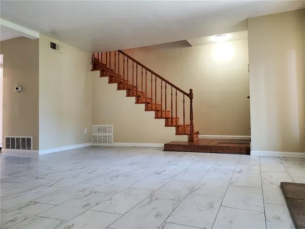 a view of entryway and hall with a window
