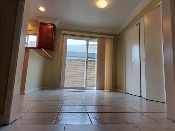 a view of entryway with kitchen