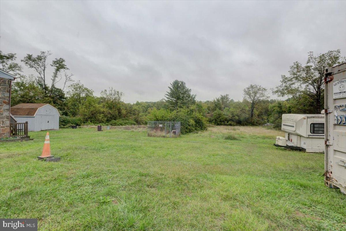 7306 Dogwood Road Baltimore, MD 21244 - Photo 11 of 37 Spacious lot with lush greenery and trees.