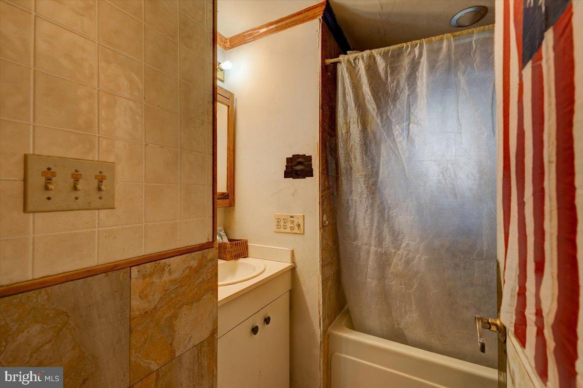 7306 Dogwood Road Baltimore, MD 21244 - Photo 23 of 37 Cozy bathroom with vintage charm.