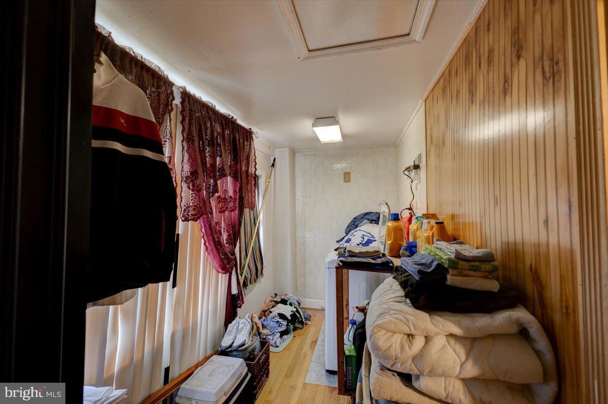 7306 Dogwood Road Baltimore, MD 21244 - Photo 29 of 37 Cozy laundry nook with warm wooden accents.