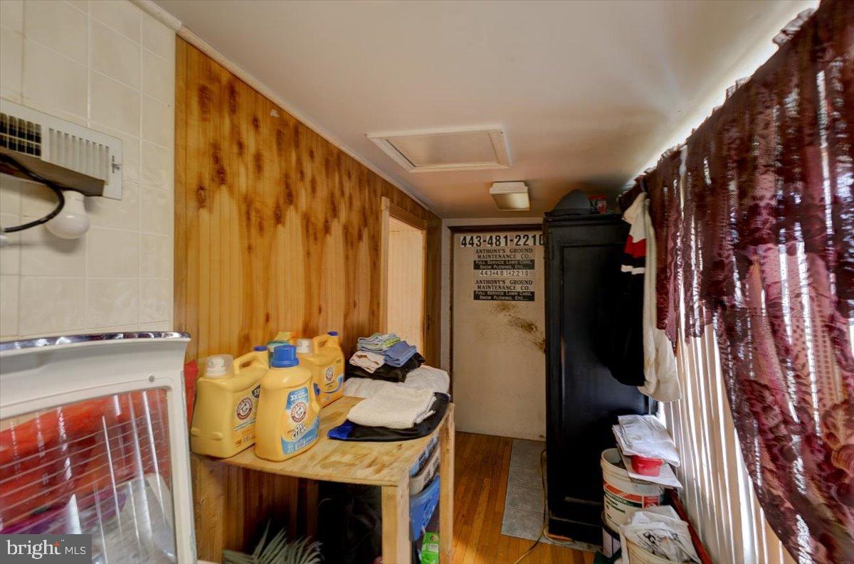 7306 Dogwood Road Baltimore, MD 21244 - Photo 30 of 37 Cozy entryway with warm wooden accents.