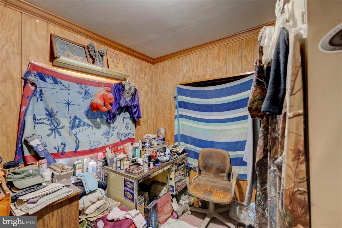 7306 Dogwood Road Baltimore, MD 21244 - Photo 32 of 37 Cluttered space with eclectic decor elements.